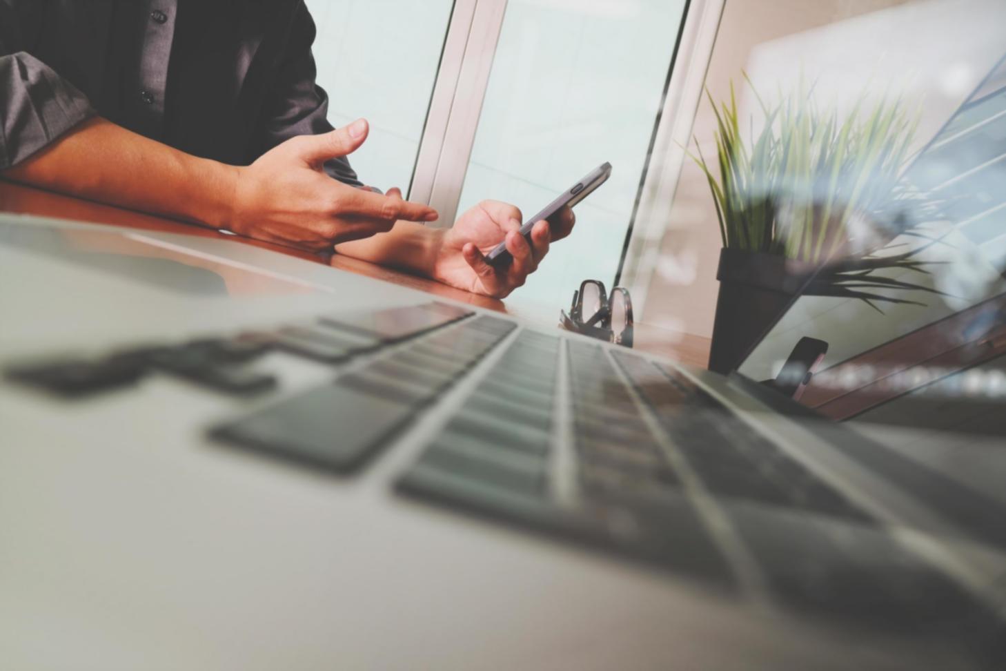 Team analyzing performance metrics on multiple monitors showing real-time system data